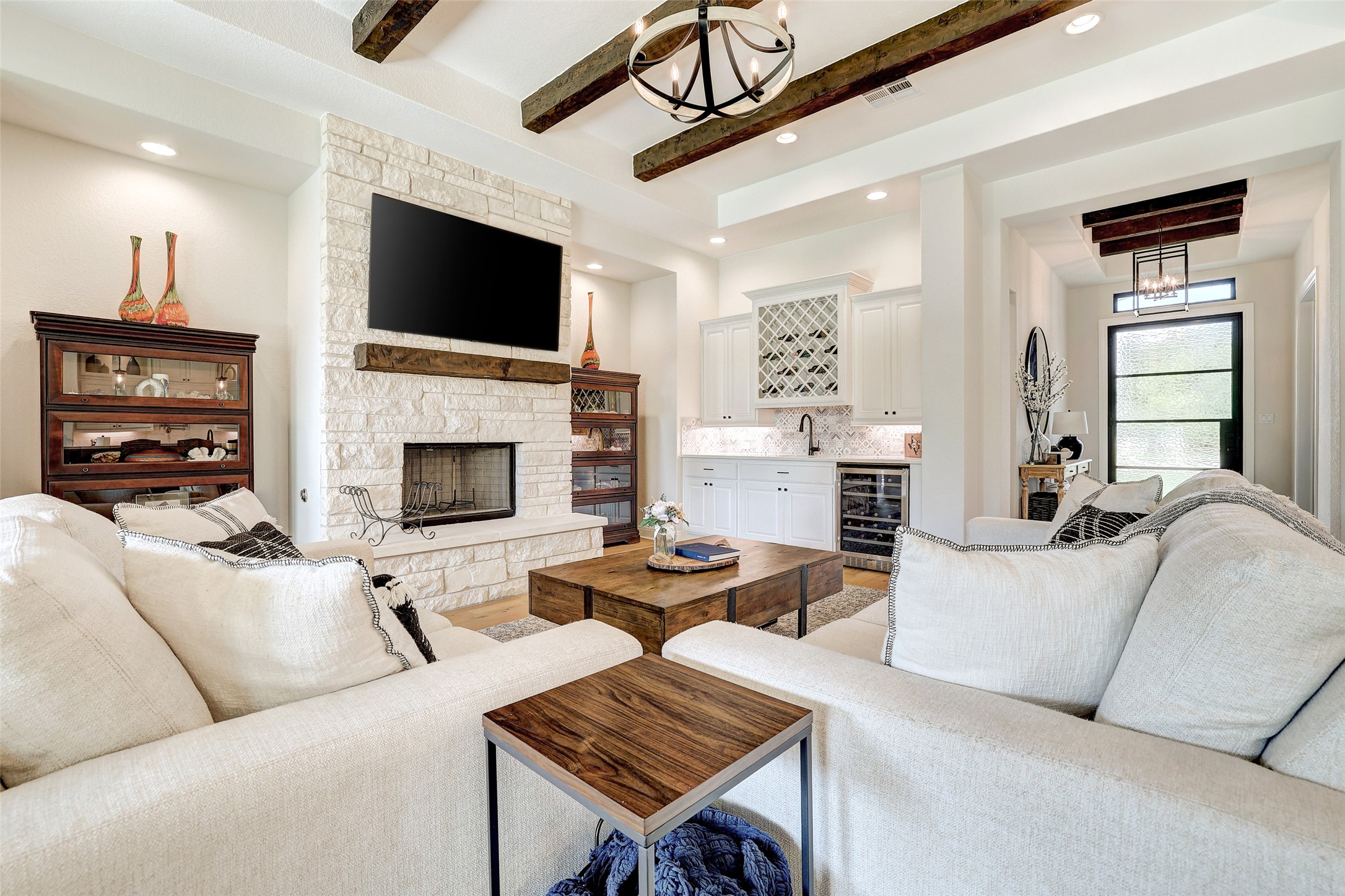 400 Flint Ridge Trail Georgetown, TX 78628 - Photo 2 of 40 Living room that has a beverage bar and stone fireplace