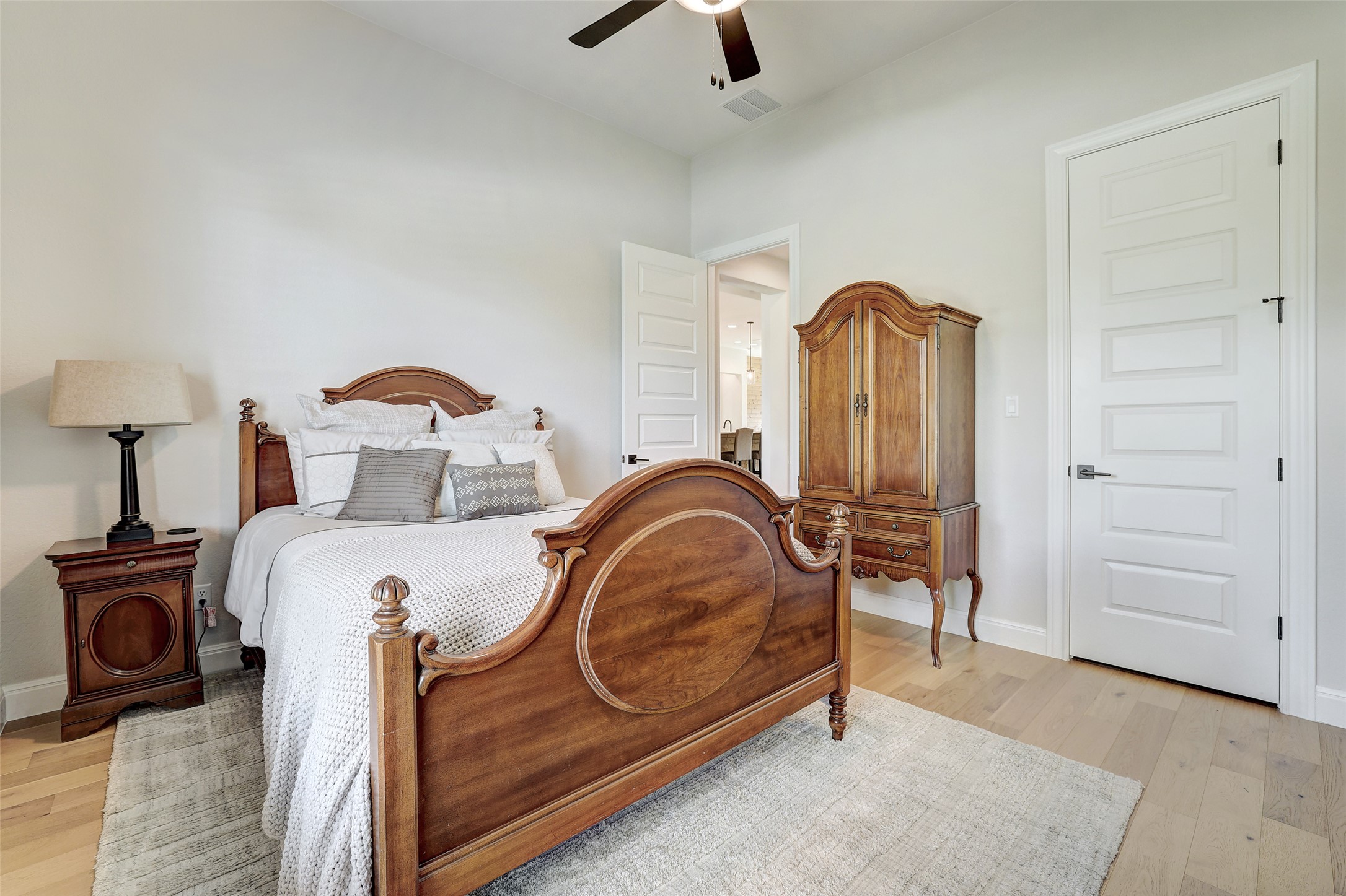400 Flint Ridge Trail Georgetown, TX 78628 - Photo 21 of 40 Bedroom featuring light wood floors and a ceiling fan