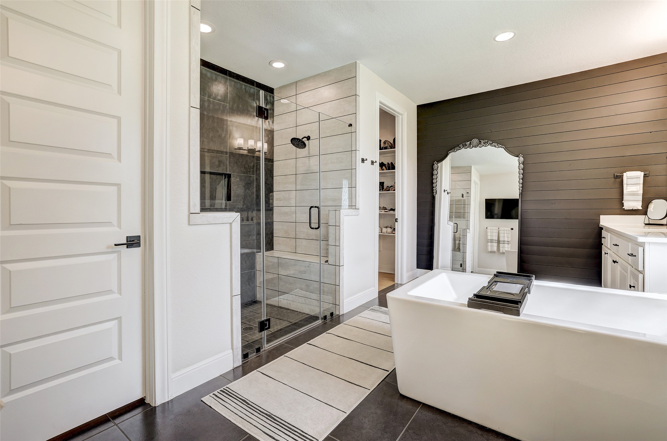 400 Flint Ridge Trail Georgetown, TX 78628 - Photo 4 of 40 Spa Like Primary Bathroom featuring a spacious closet, a shower, tile a freestanding tub, and vanity