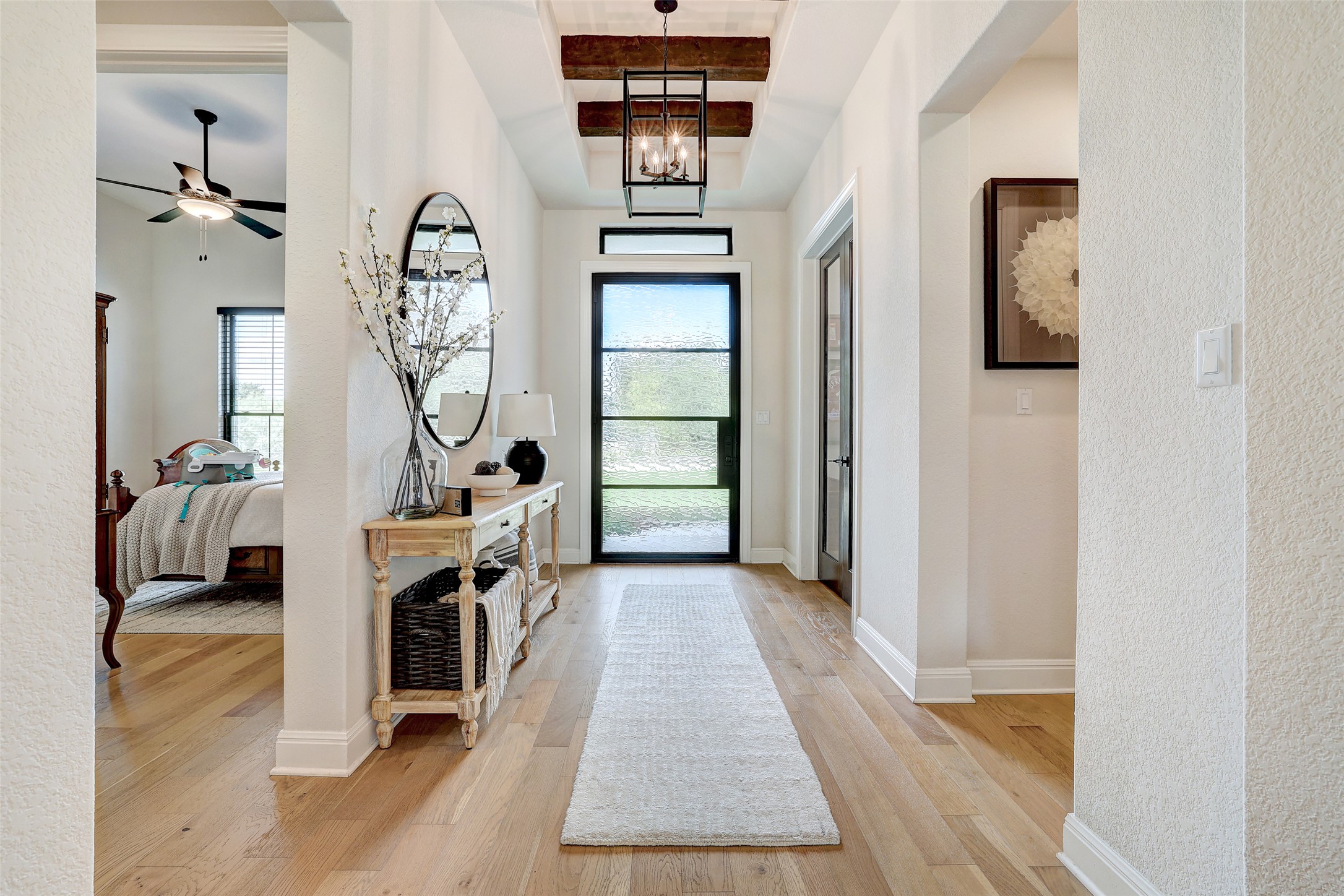 400 Flint Ridge Trail Georgetown, TX 78628 - Photo 9 of 40 Foyer featuring light wood floors, a beautiful chandelier
