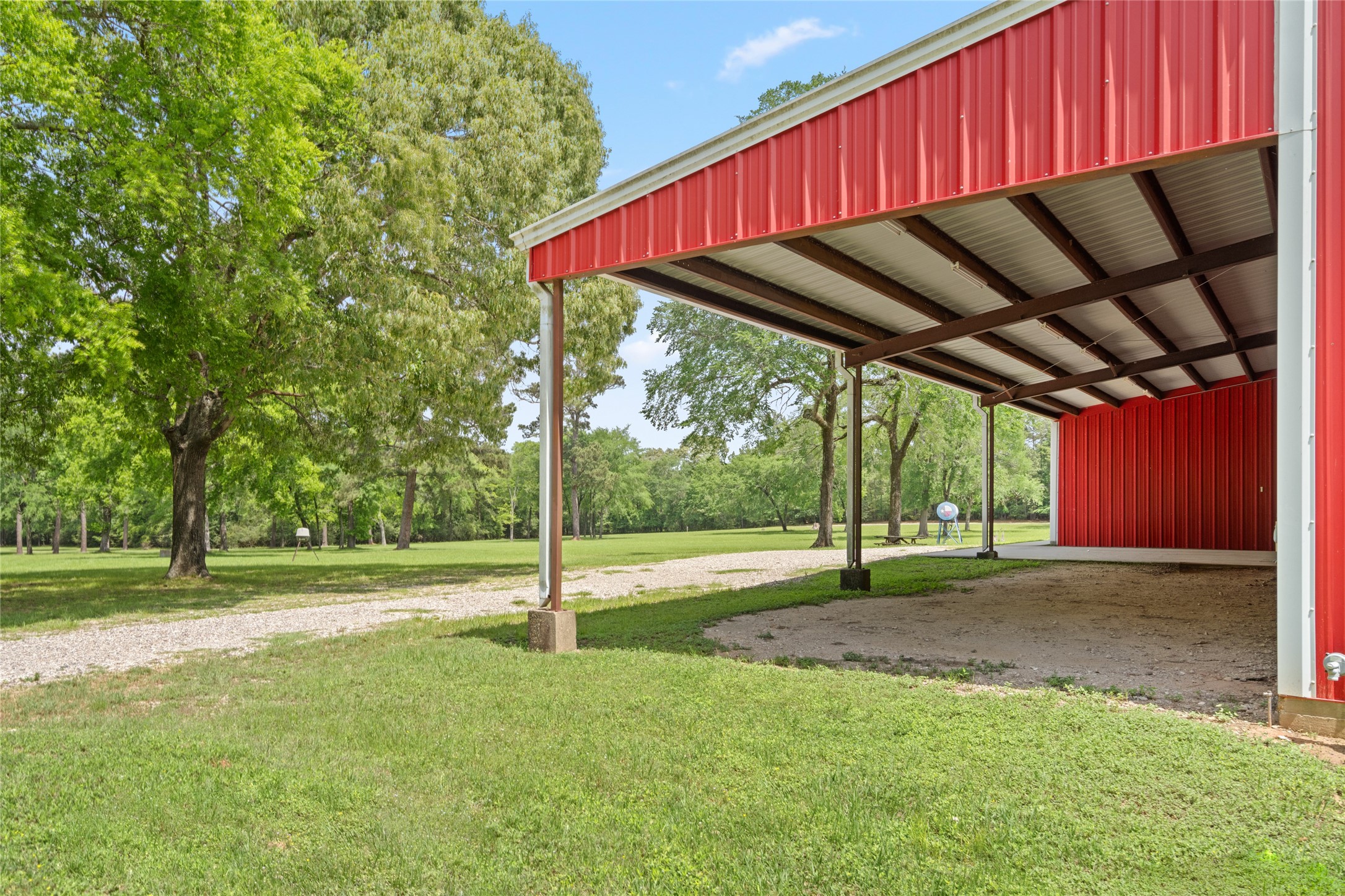 15126 Walden Road Montgomery, TX 77356 - Photo 20 of 50 Protected outdoor space for shade, parking, and family gatherings positioned to take in the meadows and the landscape.