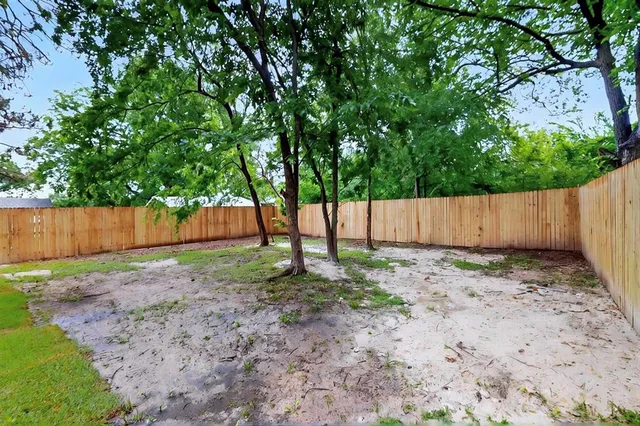 a backyard of a house with lots of green space