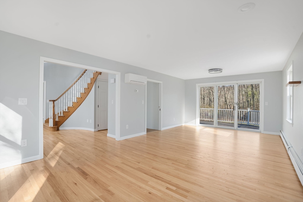 295 Frenchtown Road East Greenwich, RI 02818 - Photo 8 of 26 a view of an empty room with wooden floor and a window