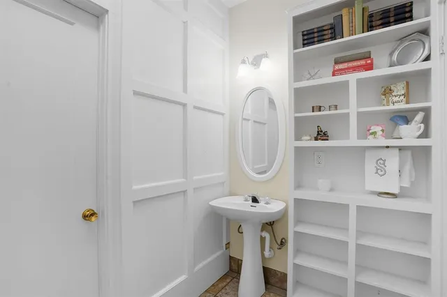 a view of a chairs and table in a backyard