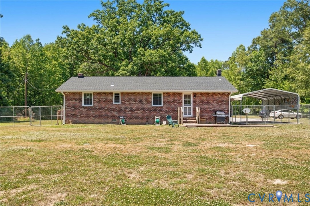 15503 Eppes Road Dewitt, VA 23840 - Photo 17 of 22 a front view of a house with a garden