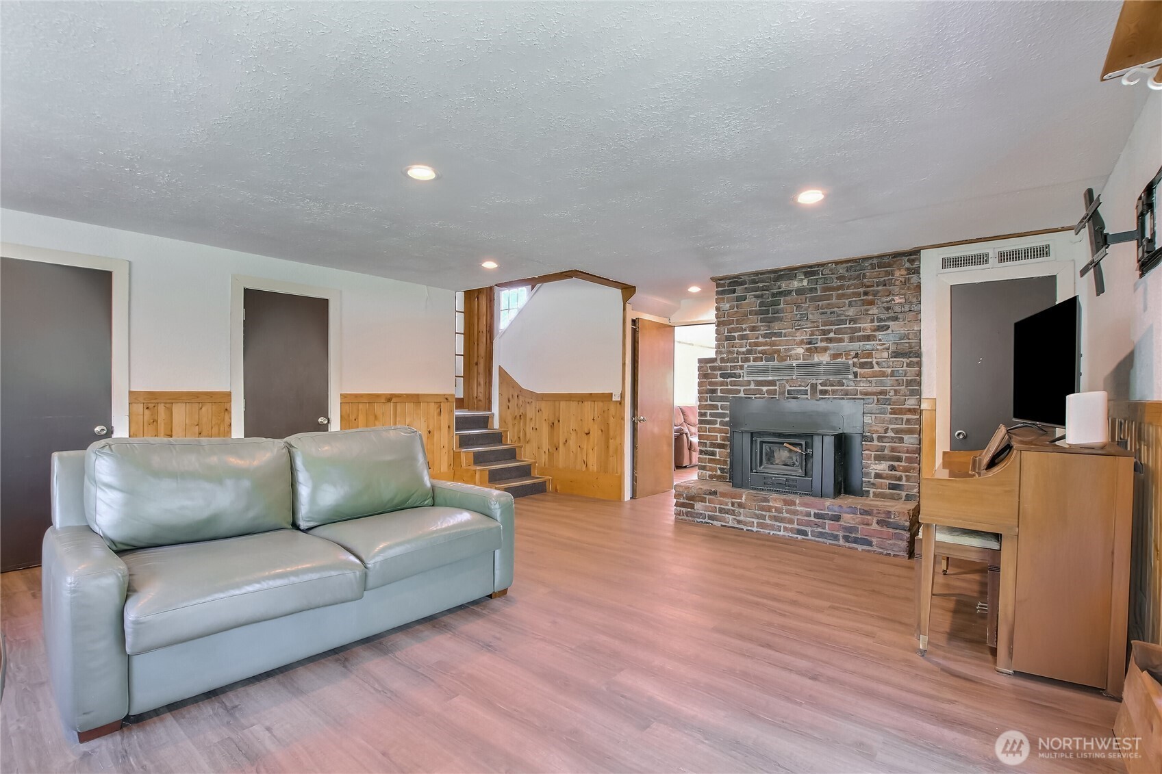 13610 Southeast 288th Street Kent, WA 98042 - Photo 28 of 32 a living room with furniture and a fireplace