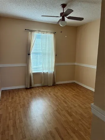 a view of a house with a swimming pool and sitting area