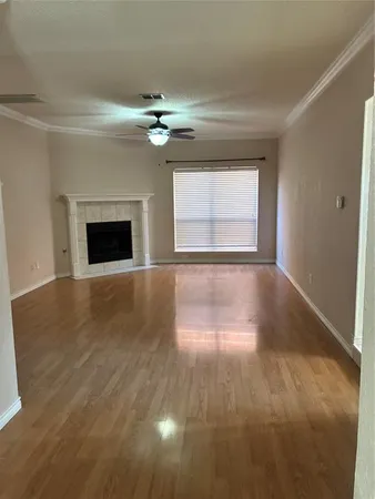 a kitchen with kitchen island granite countertop a stove top oven microwave and cabinets
