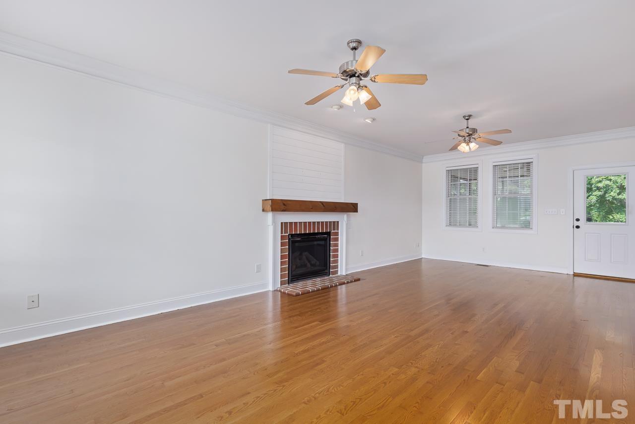65 Bess Lane Angier, NC 27501 - Photo 12 of 38 a view of an empty room with a window and wooden floor