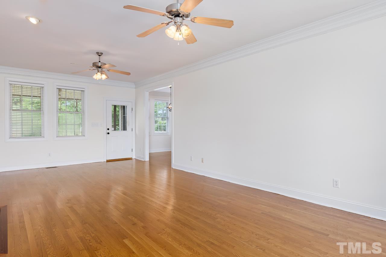 65 Bess Lane Angier, NC 27501 - Photo 13 of 38 wooden floor in an empty room with a window