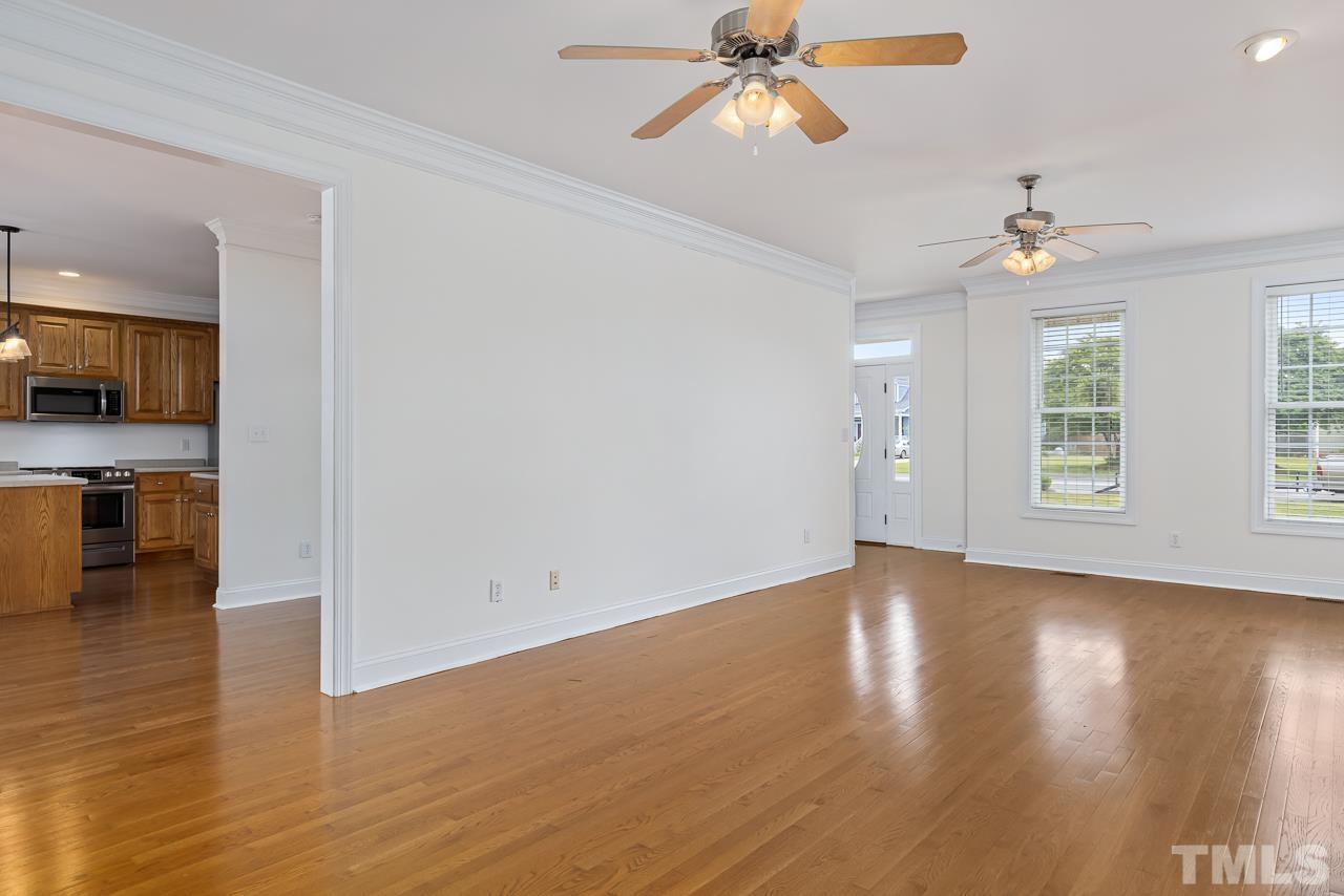 65 Bess Lane Angier, NC 27501 - Photo 14 of 38 a view of an empty room with window and wooden floor