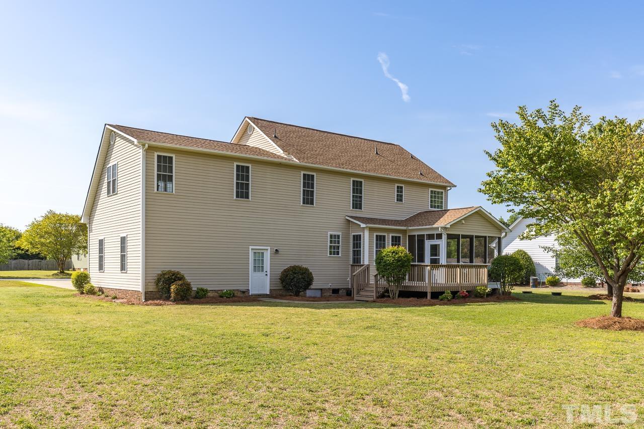 65 Bess Lane Angier, NC 27501 - Photo 2 of 38 a front view of house with an outdoor space and seating