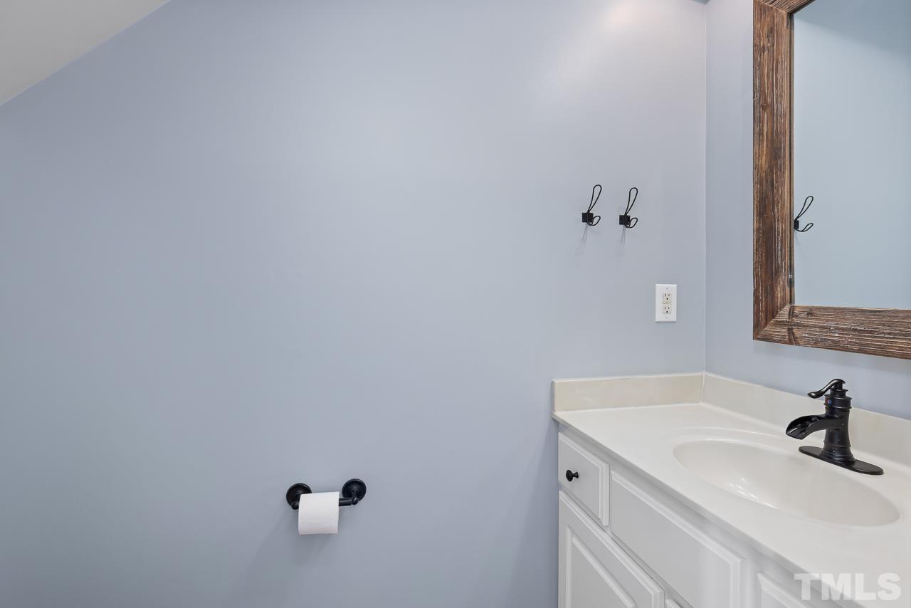 65 Bess Lane Angier, NC 27501 - Photo 23 of 38 a bathroom with a sink and a window