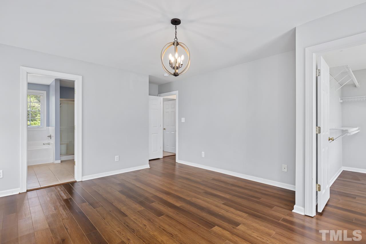 65 Bess Lane Angier, NC 27501 - Photo 25 of 38 a view of an empty room with wooden floor