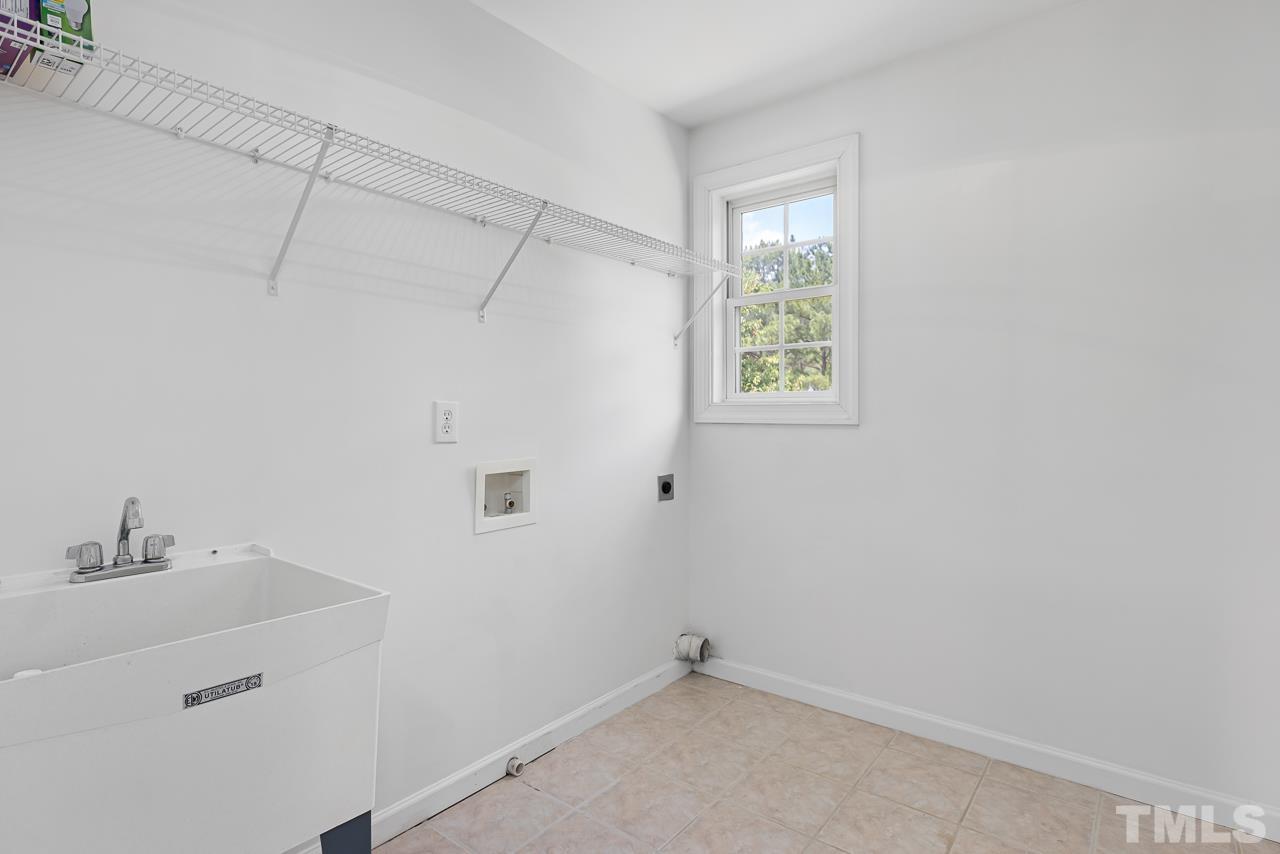 65 Bess Lane Angier, NC 27501 - Photo 29 of 38 a bathroom with a window and a shower