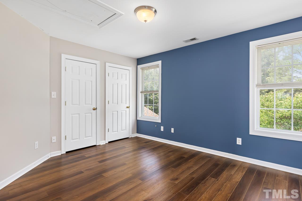 65 Bess Lane Angier, NC 27501 - Photo 30 of 38 a view of an empty room with wooden floor and a window