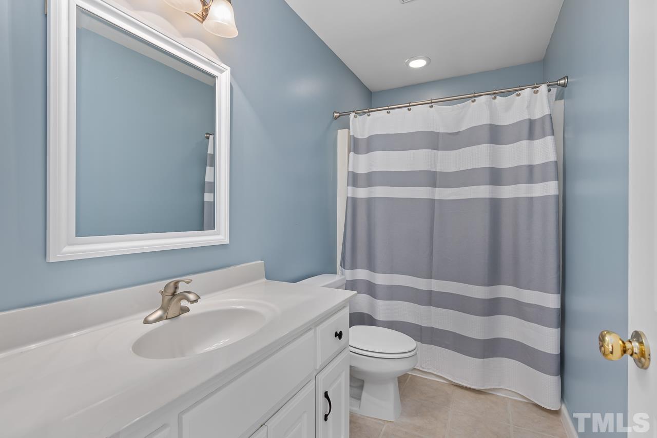 65 Bess Lane Angier, NC 27501 - Photo 31 of 38 a bathroom with a sink toilet and shower