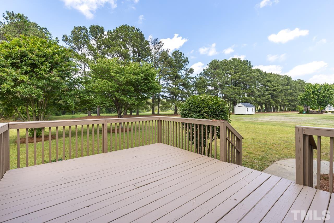 65 Bess Lane Angier, NC 27501 - Photo 37 of 38 a balcony with wooden floor and fence