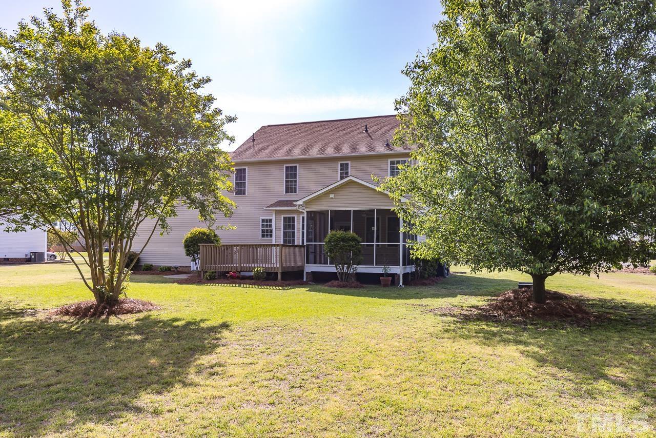 65 Bess Lane Angier, NC 27501 - Photo 9 of 38 a view of a house with swimming pool and sitting area