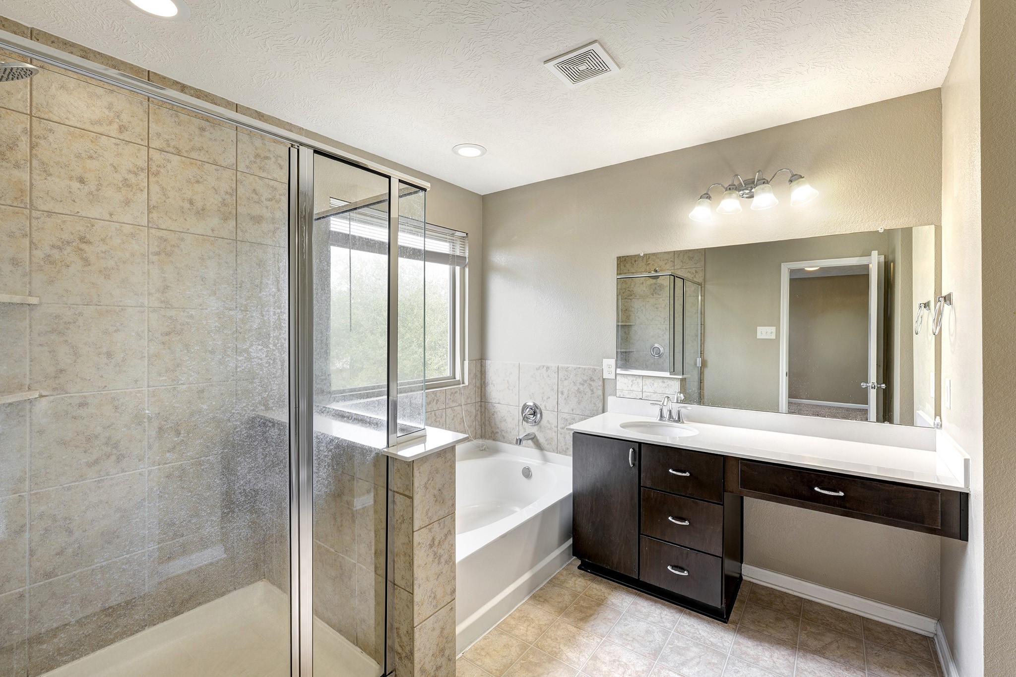 18953 Bobcat Path Houston, TX 77073 - Photo 11 of 21 a en suite bathroom with a double vanity sink and a mirror
