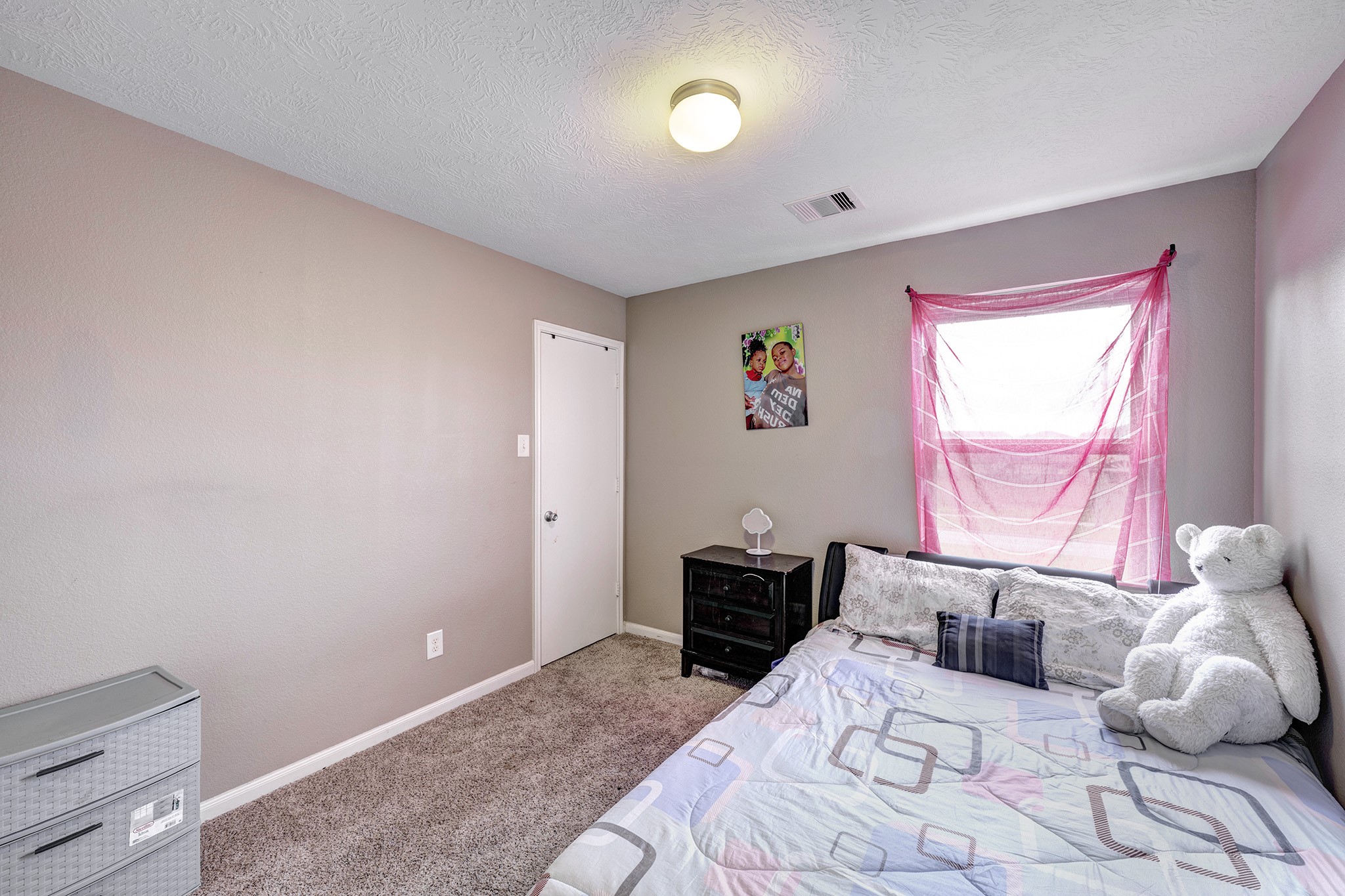 18953 Bobcat Path Houston, TX 77073 - Photo 12 of 21 a bedroom with a bed and a window