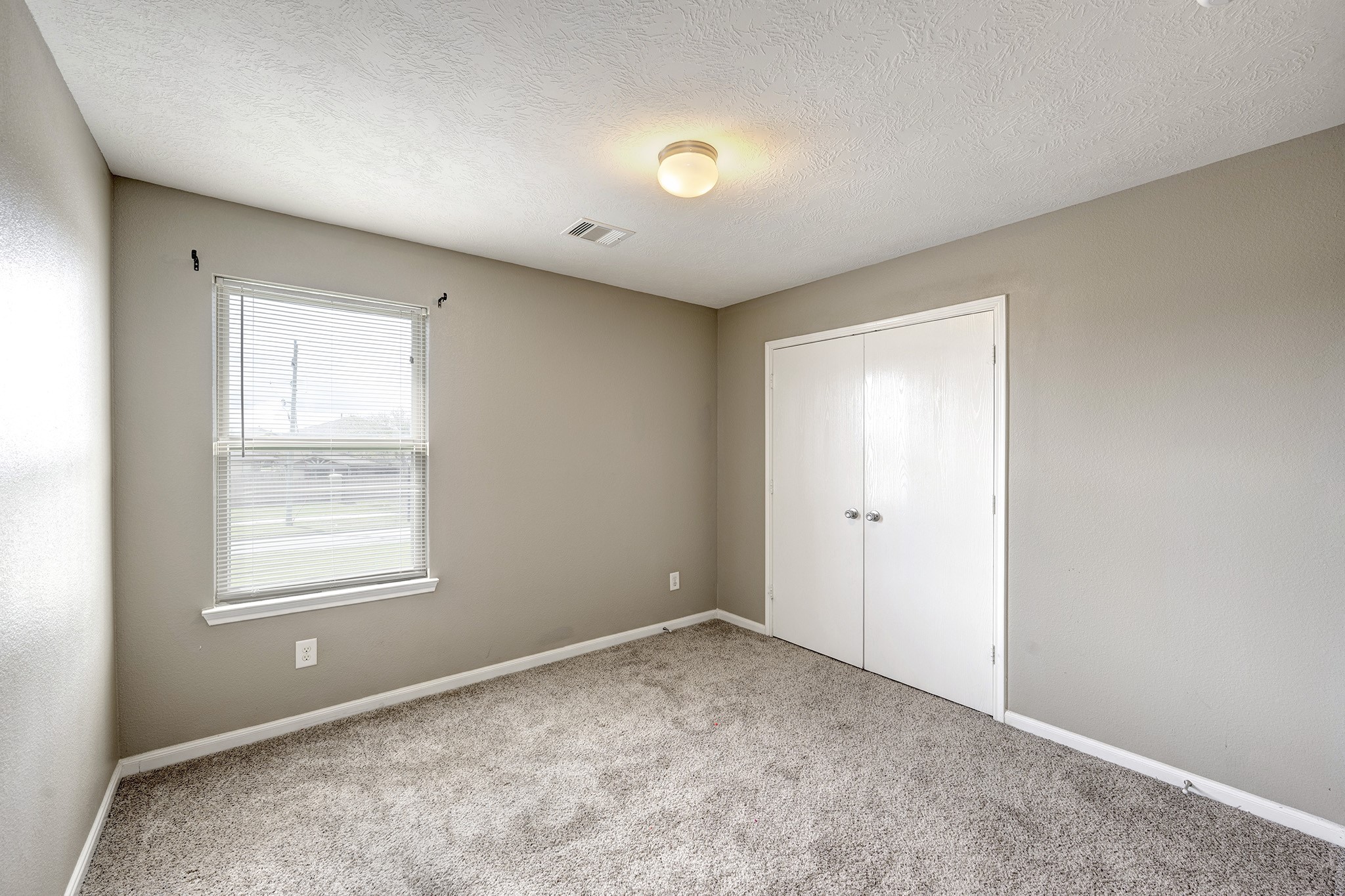 18953 Bobcat Path Houston, TX 77073 - Photo 14 of 21 a view of an empty room with a window