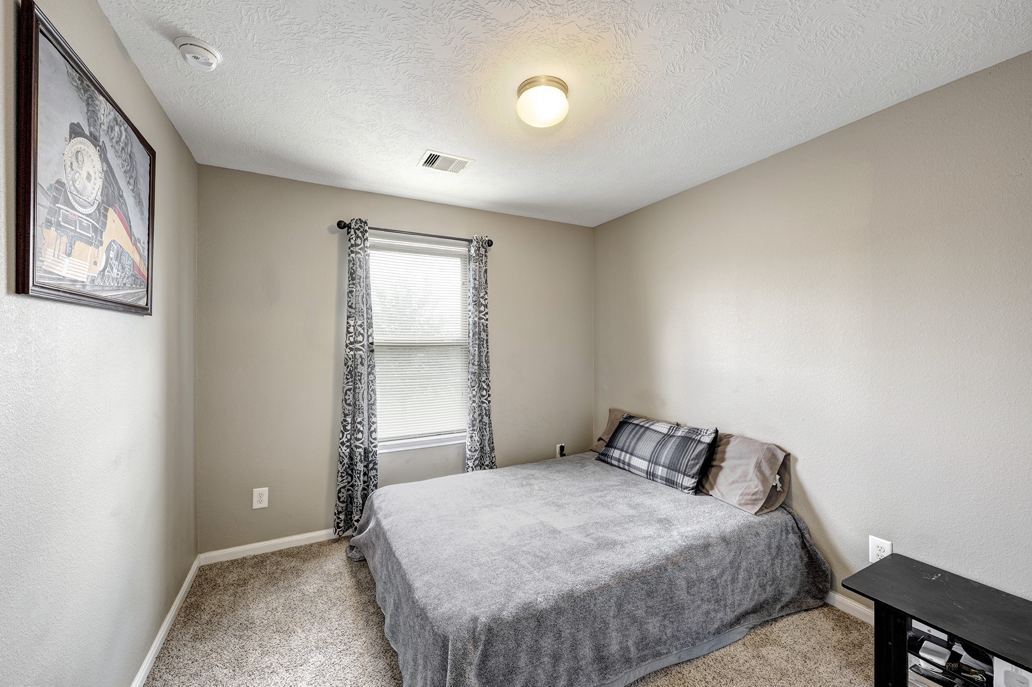 18953 Bobcat Path Houston, TX 77073 - Photo 15 of 21 a bedroom with a bed and a window