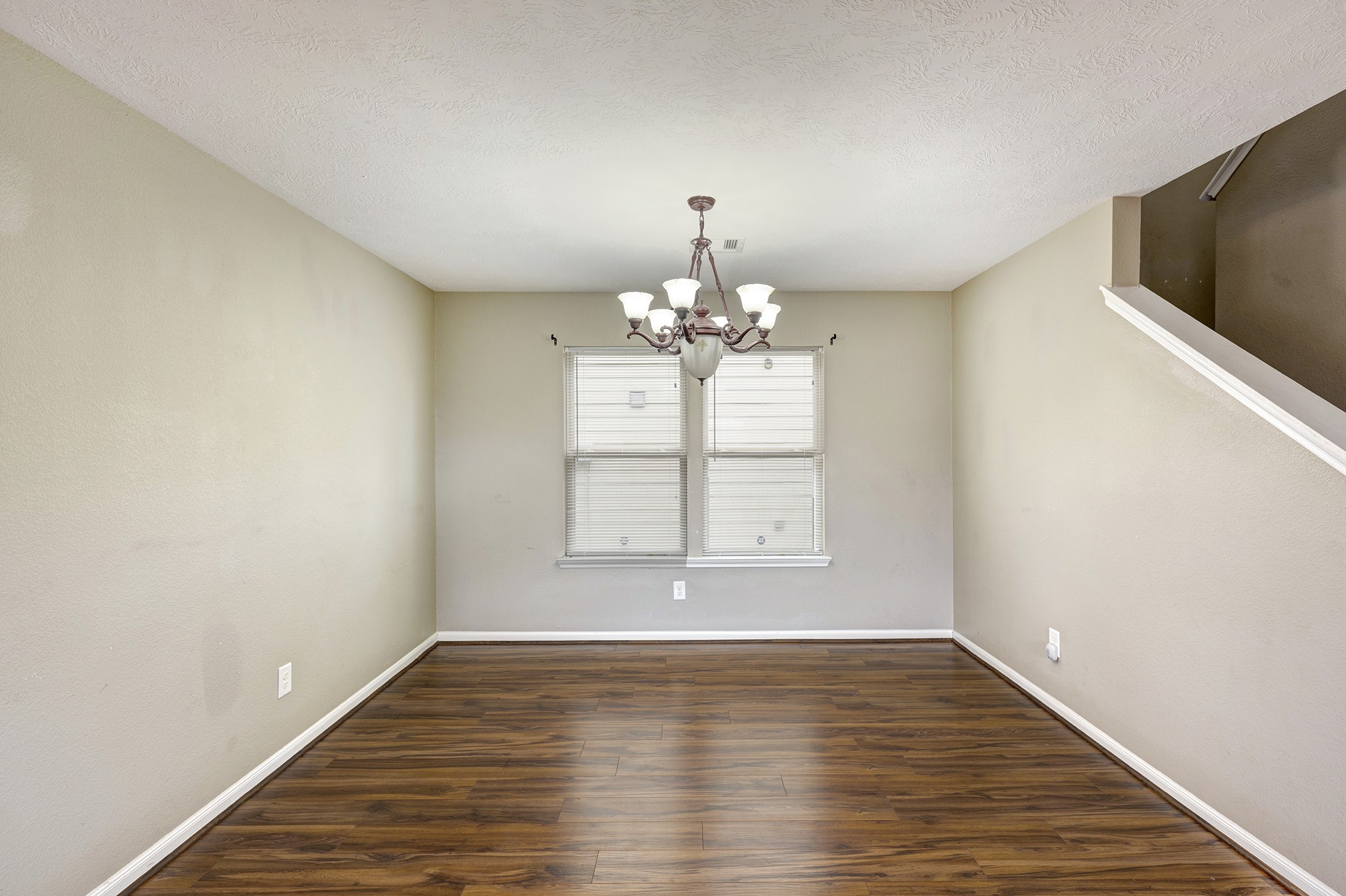 18953 Bobcat Path Houston, TX 77073 - Photo 19 of 21 a view of an empty room with wooden floor and a window