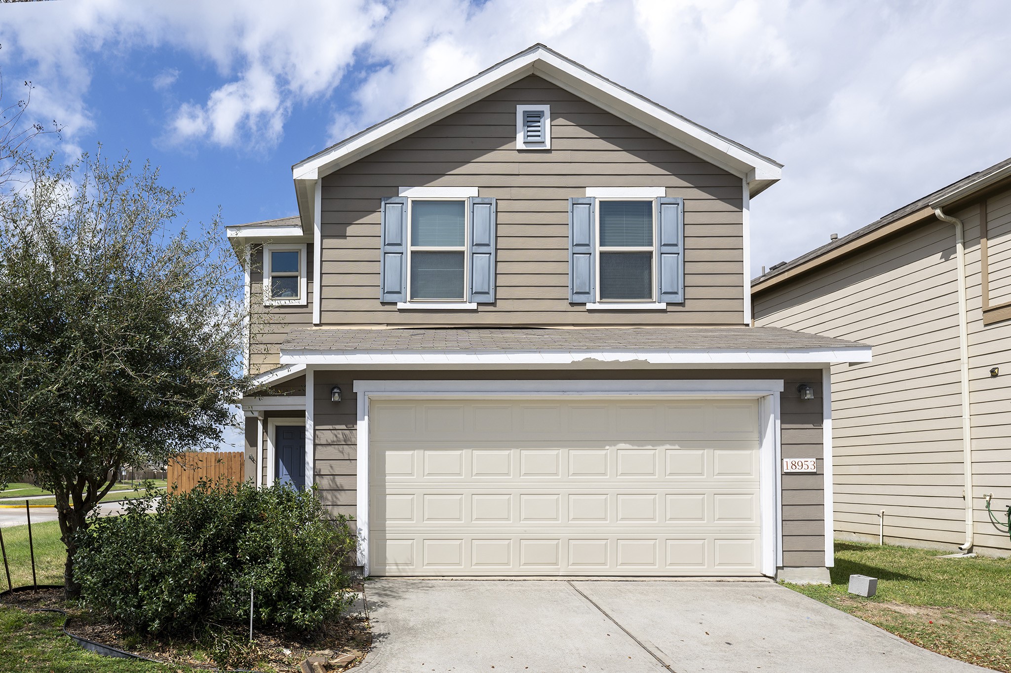 18953 Bobcat Path Houston, TX 77073 - Photo 2 of 21 a front view of a house with a garage