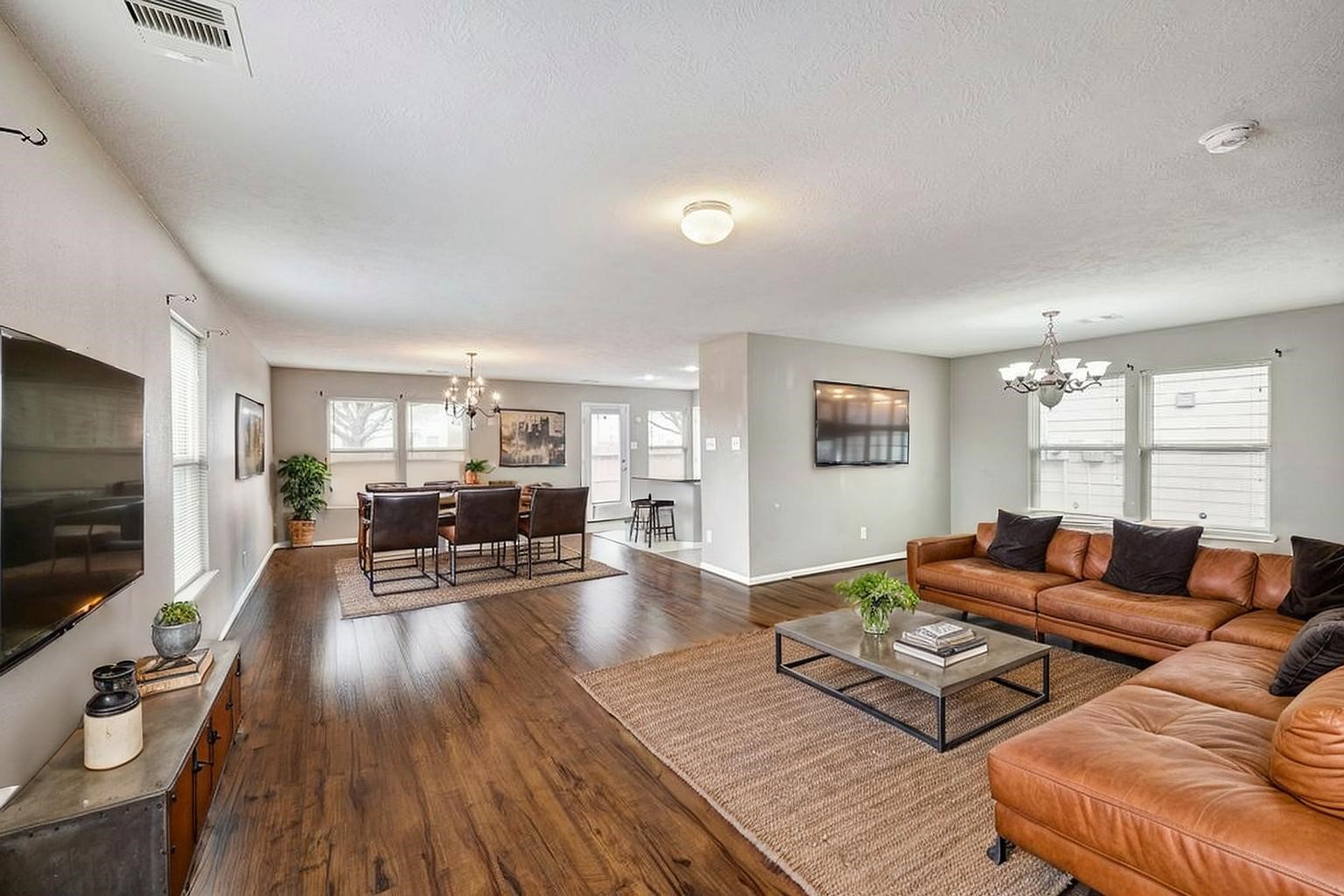18953 Bobcat Path Houston, TX 77073 - Photo 3 of 21 a living room with furniture flat screen tv and wooden floor