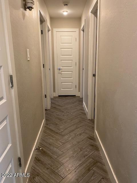 1416 East Del Rio Drive Tempe, AZ 85282 - Photo 10 of 27 a view of a hallway with wooden floor and closet