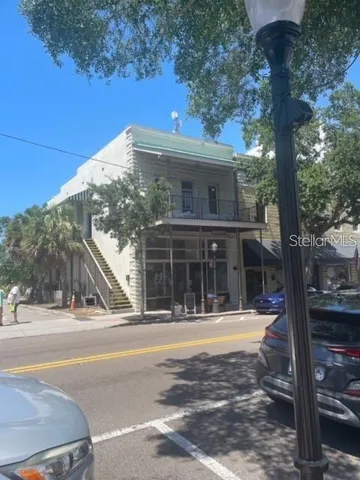 a view of a building with a tree