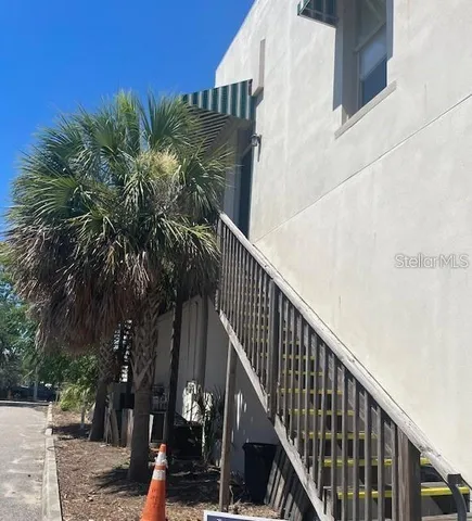 a view of balcony with wooden floor and fence