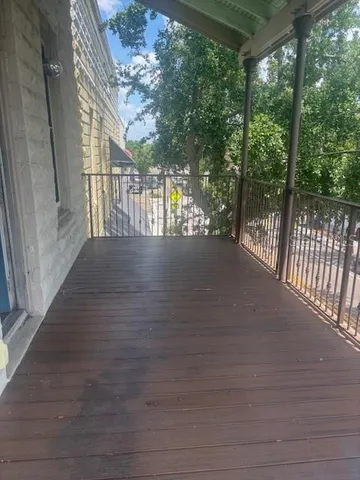 a view of balcony and trees