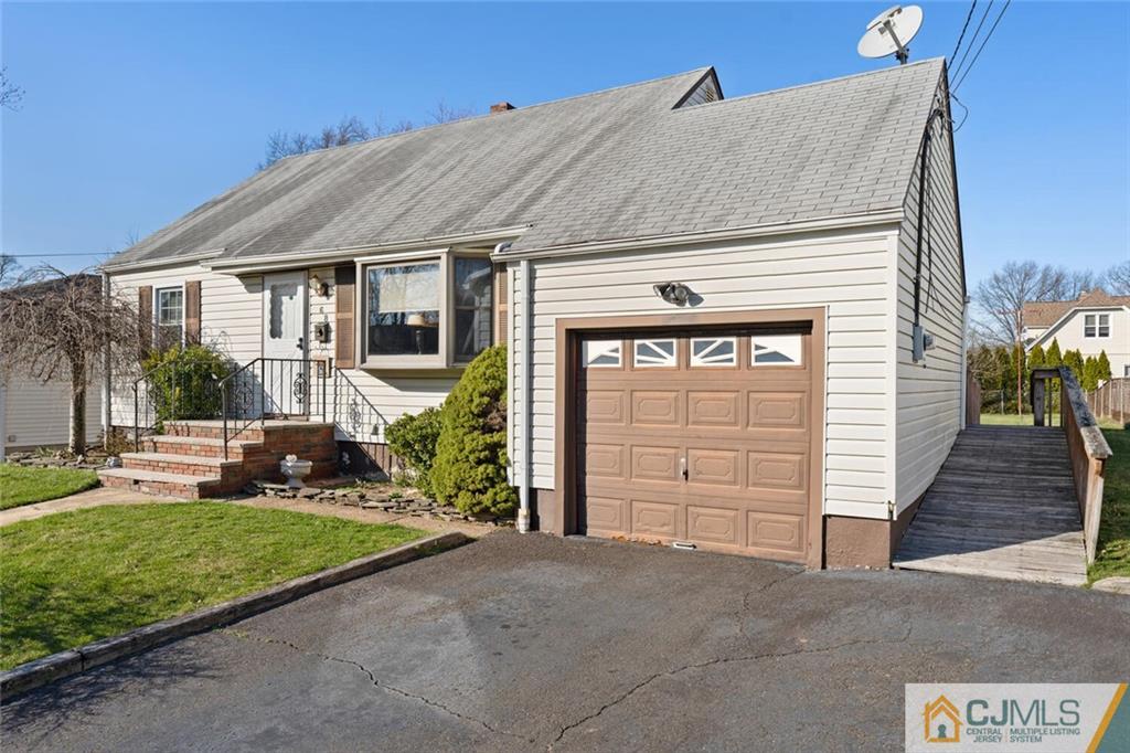 68 Middle Hill Road Colonia, NJ 07067 - Photo 1 of 33 a front view of a house with a yard