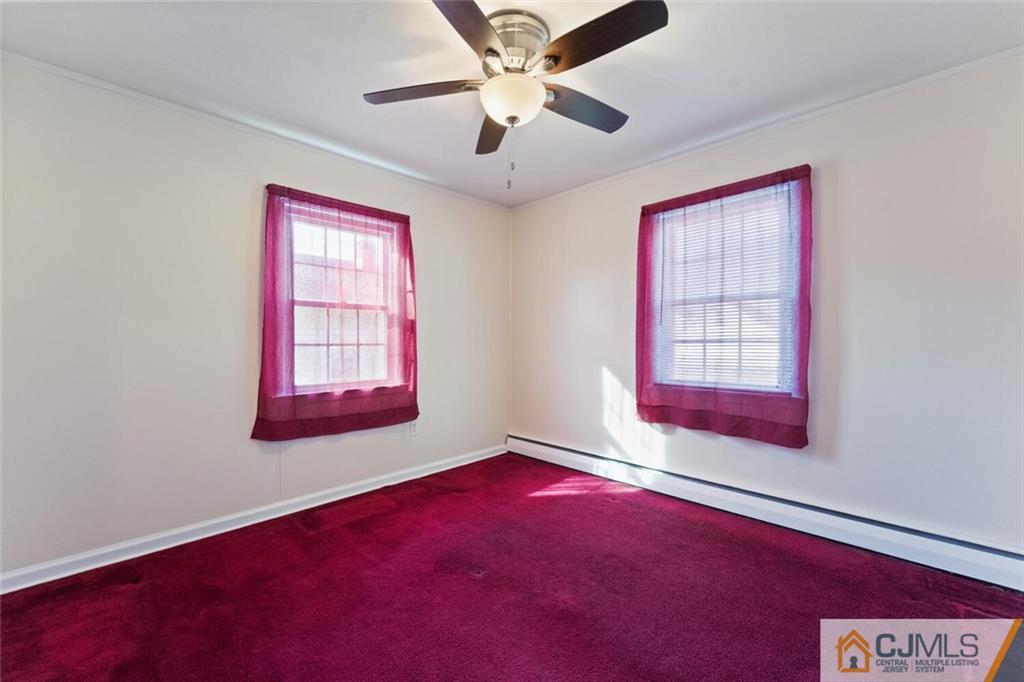 68 Middle Hill Road Colonia, NJ 07067 - Photo 14 of 33 an empty room with windows and fan