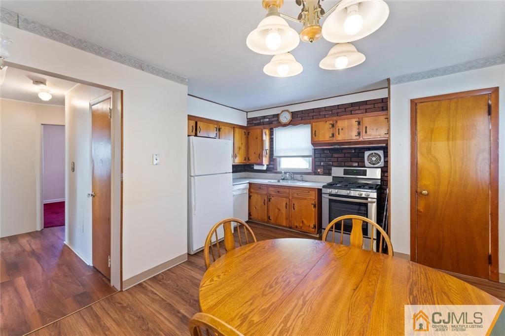 68 Middle Hill Road Colonia, NJ 07067 - Photo 7 of 33 a view of a dining room with furniture window and wooden floor
