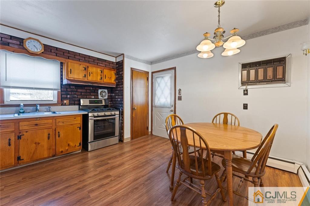 68 Middle Hill Road Colonia, NJ 07067 - Photo 8 of 33 a dining table with chairs and wooden floor
