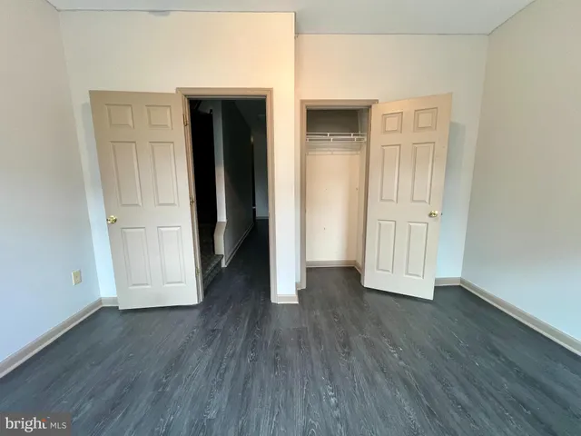 a bathroom with a sink toilet and mirror