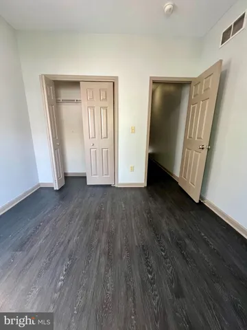 a bathroom with a sink toilet and window