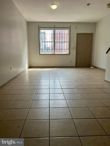 a view of a livingroom with wooden cabinets