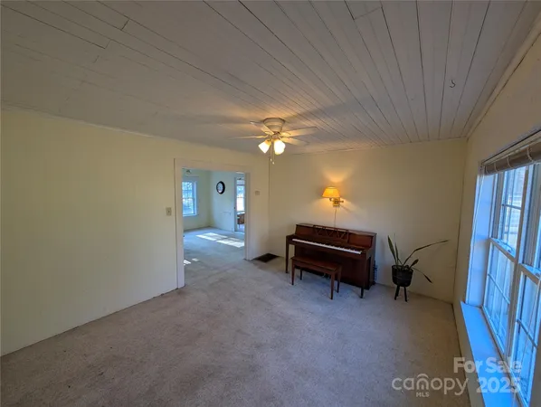 a bedroom with furniture and a chandelier
