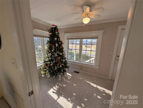 a view of a hallway to a window