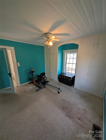 a view of a livingroom with furniture and windows