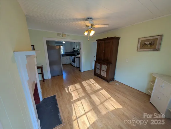 a view of a livingroom with furniture and wooden floor