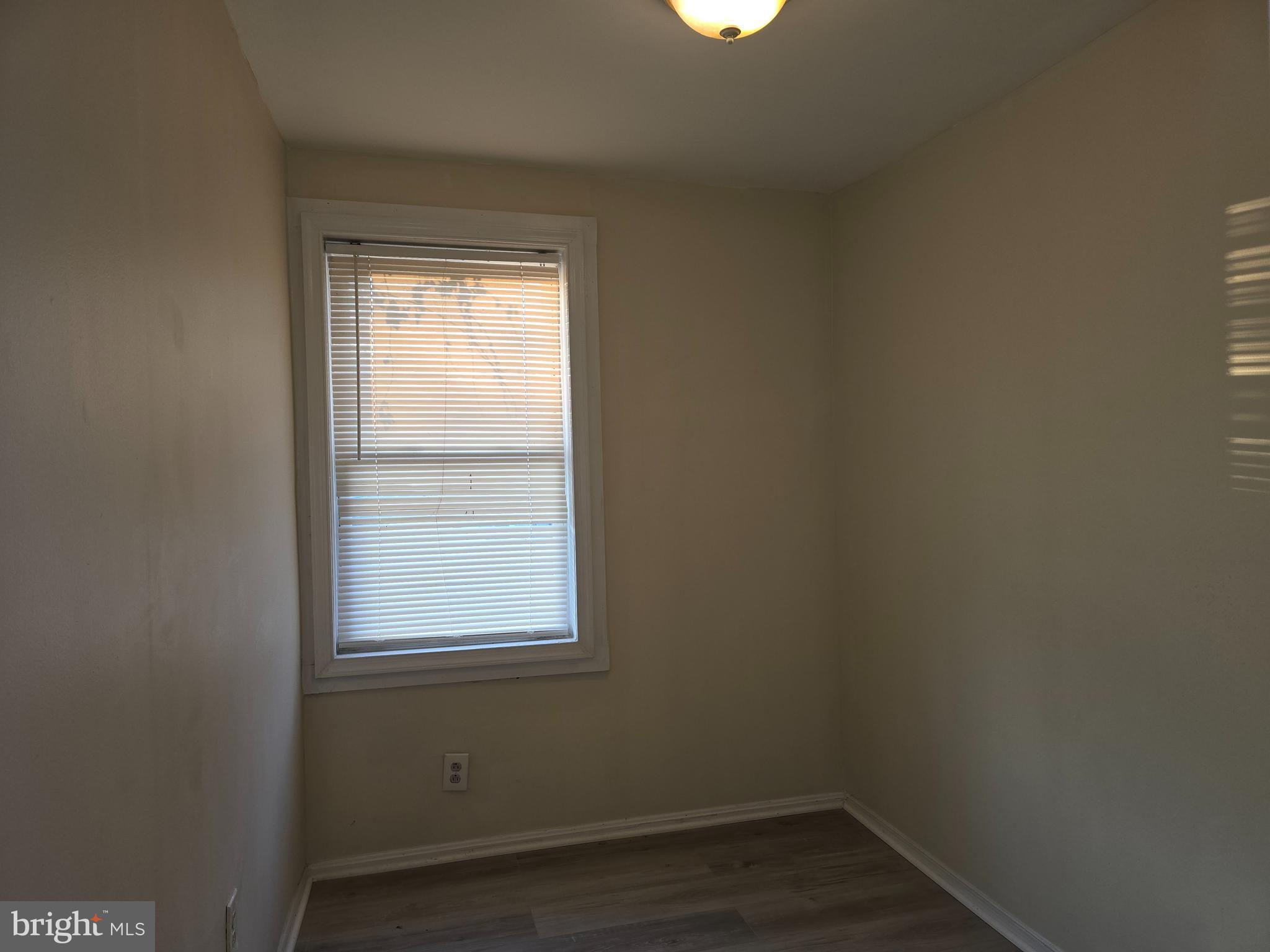 340 South Woodyear Street Baltimore, MD 21223 - Photo 14 of 19 an empty room with a window