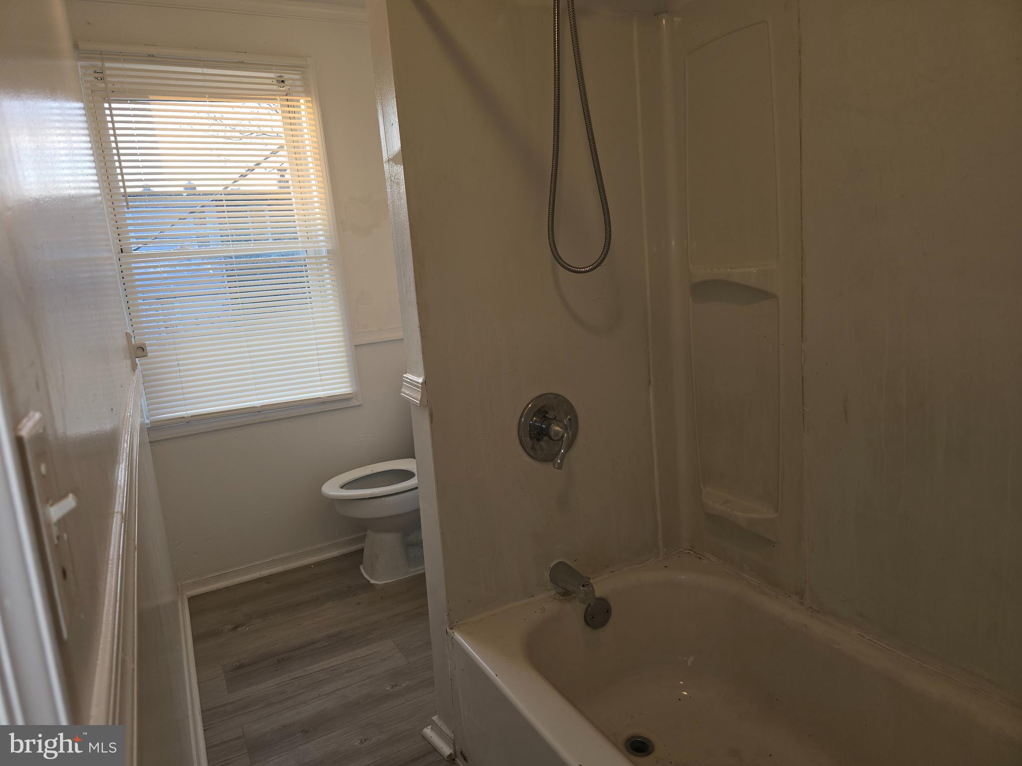 340 South Woodyear Street Baltimore, MD 21223 - Photo 15 of 19 a bathroom with a granite countertop bathtub shower and toilet