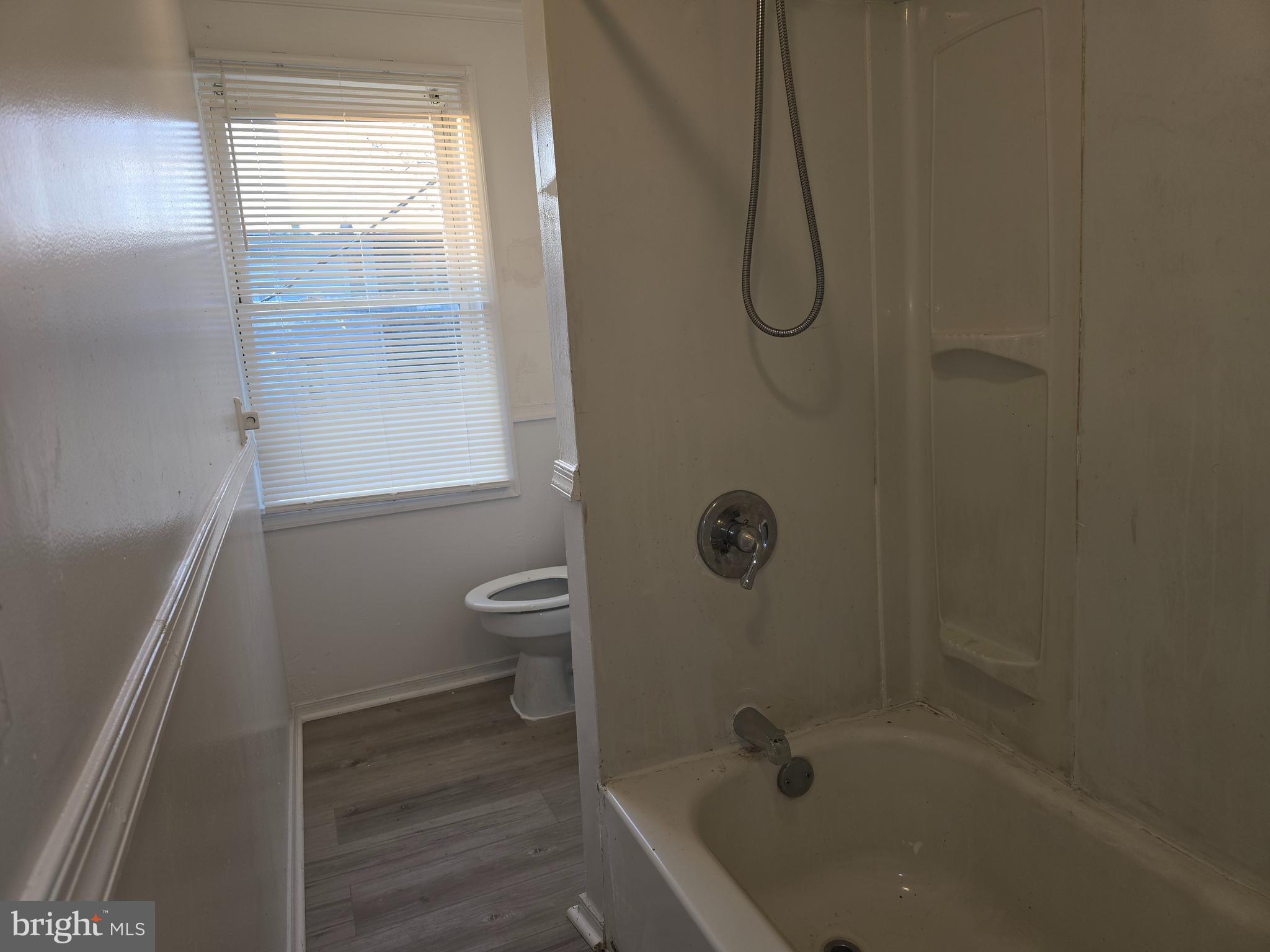 340 South Woodyear Street Baltimore, MD 21223 - Photo 16 of 19 a bathroom with a glass shower door