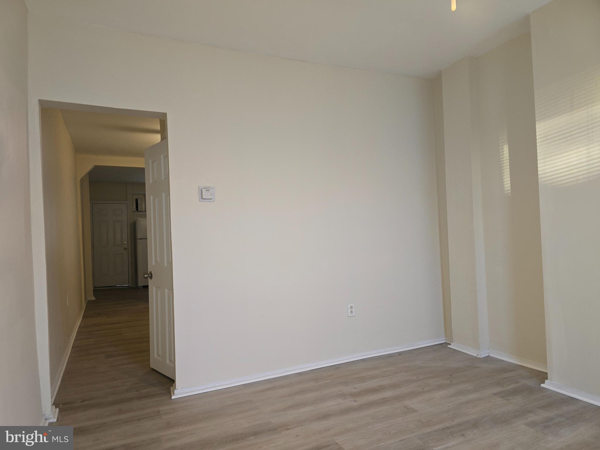 340 South Woodyear Street Baltimore, MD 21223 - Photo 3 of 19 a view of hallway with wooden floor