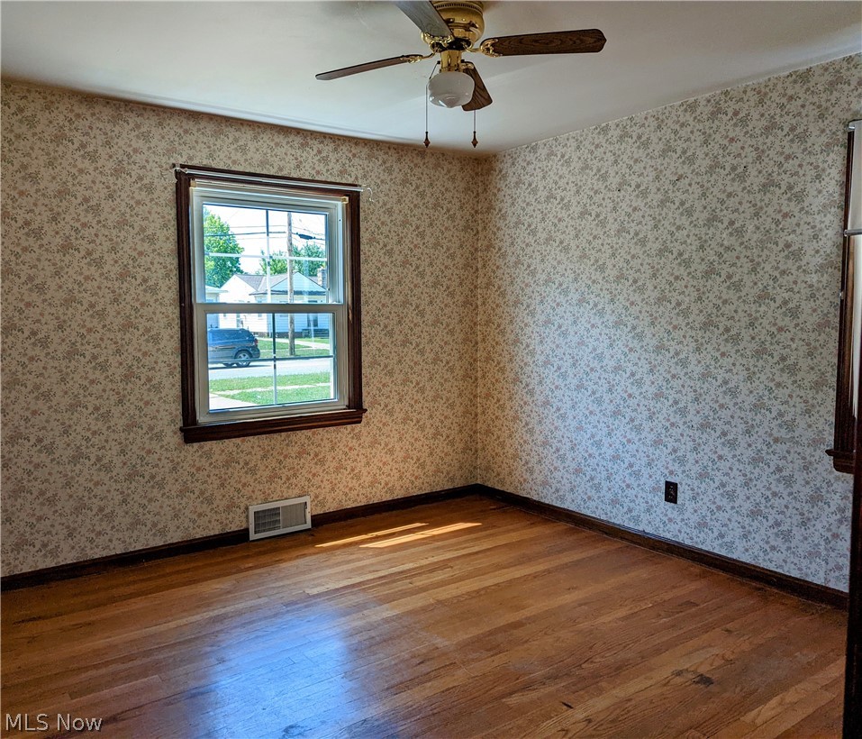 13817 Granger Road Cleveland, OH 44125 - Photo 9 of 22 Large first-floor bedroom.